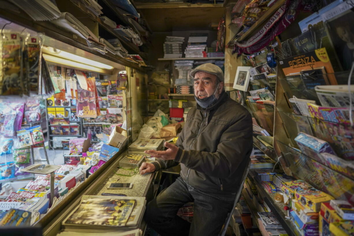 Armando Alviti, 71, sits inside his newspaper kiosk, in Rome, Friday, Dec. 4, 2020. In Italy, which has the world&#039;s second-oldest population, many people in their 70s and older have kept working through the COVID-19 pandemic. From neighborhood newsstand dealers to farmers bring crops to market, they are defying stereotypic labels that depict the old as a monolithic category that&#039;s fragile and in need of protection.