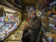 Armando Alviti, 71, sits inside his newspaper kiosk, in Rome, Friday, Dec. 4, 2020. In Italy, which has the world&#039;s second-oldest population, many people in their 70s and older have kept working through the COVID-19 pandemic. From neighborhood newsstand dealers to farmers bring crops to market, they are defying stereotypic labels that depict the old as a monolithic category that&#039;s fragile and in need of protection.