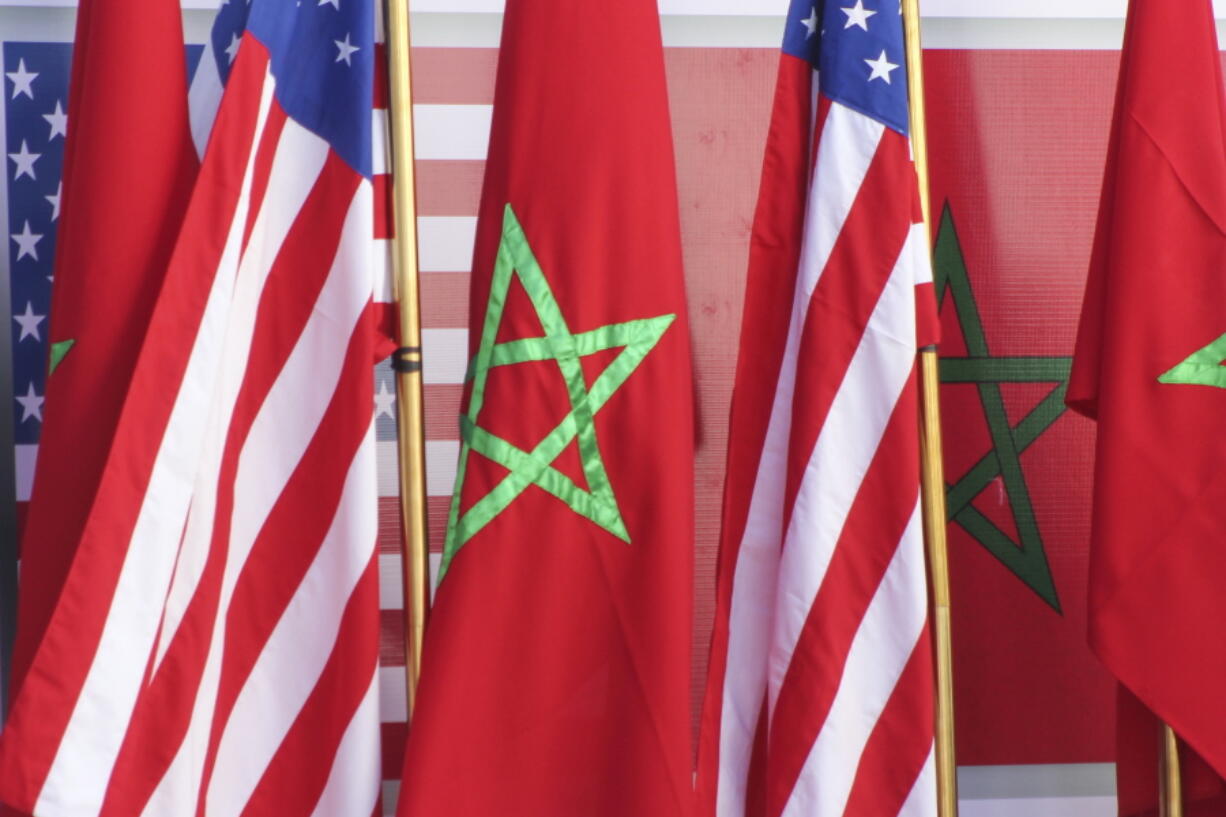 U.S and Moroccan flags stand together on the podium during a visit by David Schenker, US Assistant Secretary of State for Near Eastern Affairs, US Ambassador to Morocco David T. Fischer and Nasser Bourita, Moroccan Foreign Minister, in Dakhla, Morocco-administered Western Sahara, Sunday Jan. 10, 2021. The highest ranking U.S. diplomat for North Africa and the Middle East, as well as the first ever U.S Ambassador, traveled Sunday to the Morocco-administered Western Sahara city of Dakhla, laying the groundwork for the United States to set up a consulate in the disputed territory.