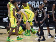 Colorado guard McKinley Wright IV, right, flexes after drawing a foul against Oregon during the second half of an NCAA college basketball game Thursday, Jan. 7, 2021, in Boulder, Colo. Colorado won 79-72.