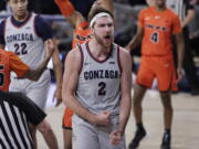 Gonzaga forward Drew Timme celebrates after scoring a basket during the first half of the team's NCAA college basketball game against Pacific in Spokane, Wash., Saturday, Jan. 23, 2021.