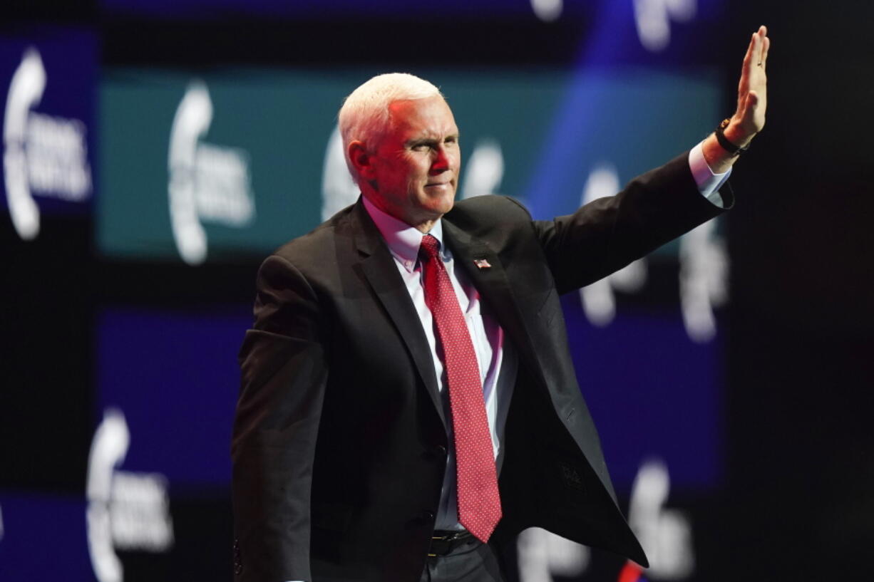 Vice President Mike Pence waves as he walks off the stage after speaking at the Turning Point USA Student Action Summit, Tuesday, Dec. 22, 2020, in West Palm Beach, Fla.