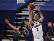 Gonzaga forward Drew Timme (2) shoots while pressured by Pepperdine forward Kene Chukwuka (24) during the first half of an NCAA college basketball game in Spokane, Wash., Thursday, Jan. 14, 2021.