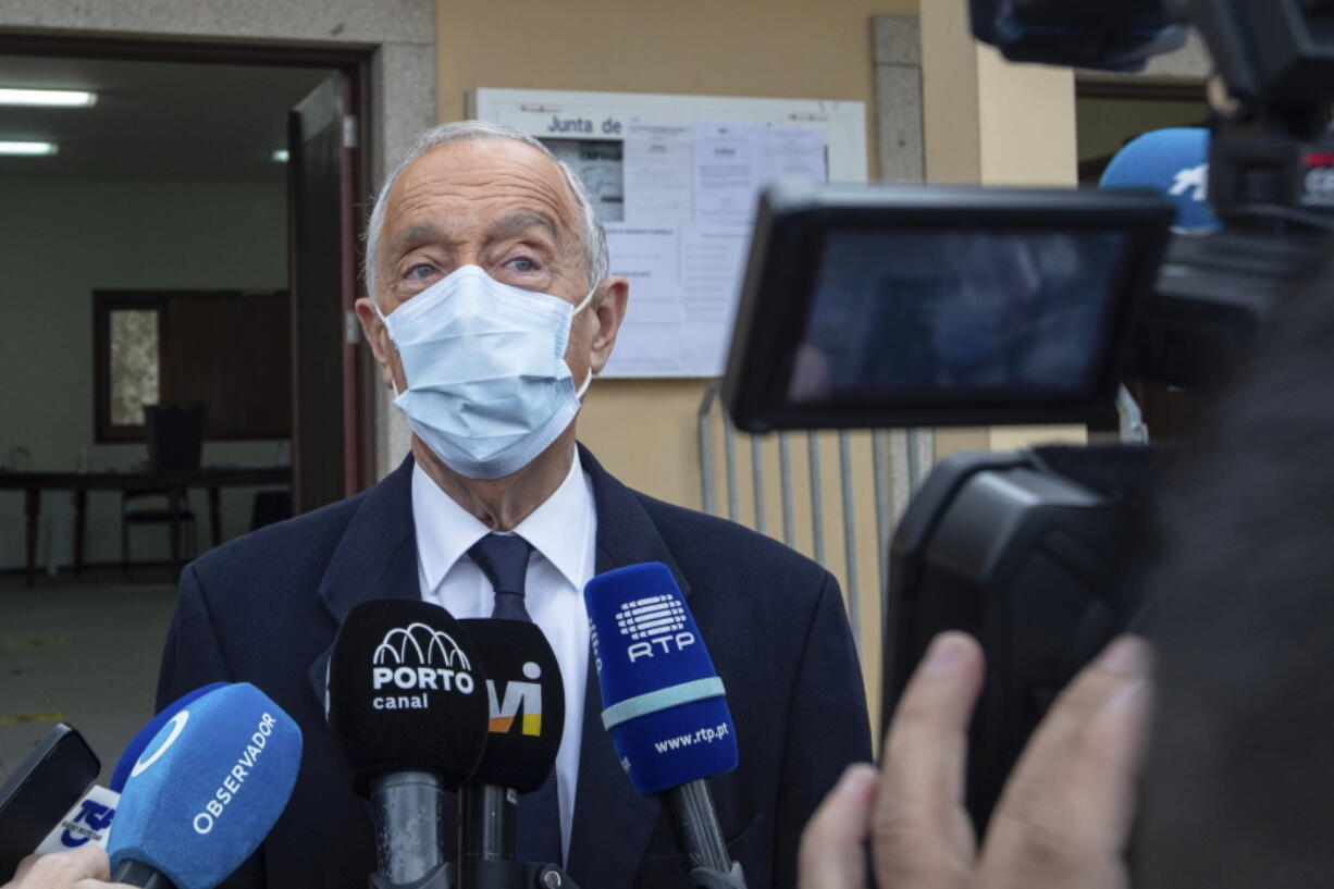 Portuguese President, and candidate for reelection, Marcelo Rebelo de Sousa speaks to journalists after voting at a polling station in Celorico de Basto, northern Portugal, Sunday, Jan. 24, 2021. Portugal holds a presidential election Sunday, choosing a head of state to serve a five-year term.