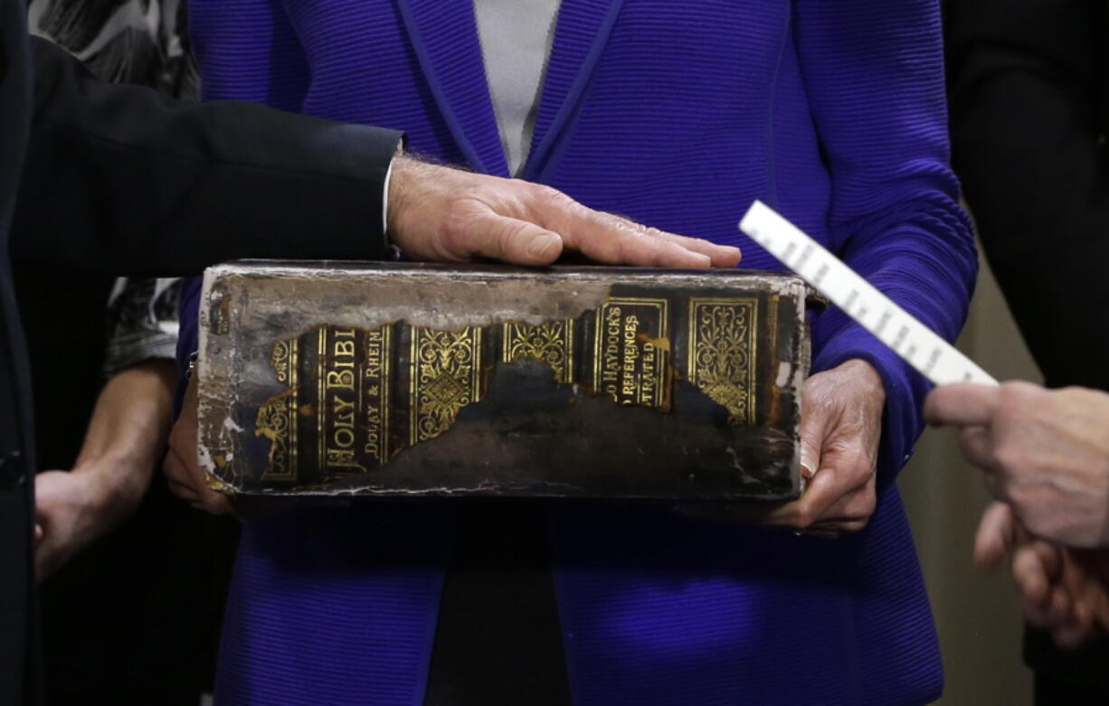 FILE - In this Sunday, Jan. 20, 2013 file photo, Vice President Joe Biden, left, places his hand on the Biden family Bible held by his wife, Jill Biden, center, as he takes the oath of office from Supreme Court Justice Sonia Sotomayor, right, during an official ceremony at the Naval Observatory in Washington. While many presidents have used Bibles for their inaugurations, the Constitution does not require the use of a specific text and specifies only the wording of president&#039;s oath. That wording also doesn&#039;t include the phrase &quot;so help me God,&quot; but every modern president has appended it to their oaths and most have chosen symbolically resonant Bibles for their inaugurations.