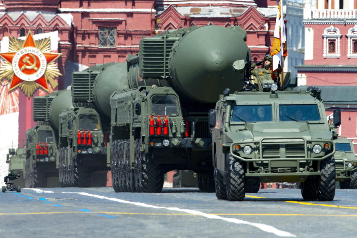 FILE - In this file photo taken on Wednesday, June 24, 2020, Russian RS-24 Yars ballistic missiles roll in Red Square during the Victory Day military parade marking the 75th anniversary of the Nazi defeat in Moscow, Russia. Russia and the United States exchanged documents Tuesday Jan. 26, 2021, to extend the New START nuclear treaty, their last remaining arms control pact, the Kremlin said. The Kremlin readout of a phone call between U.S. President Joe Biden and Russian President Vladimir Putin said they voiced satisfaction with the move.