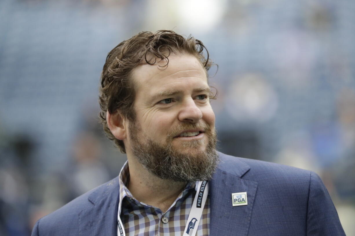 Seattle Seahawks general manager John Schneider walks on the field during warmups before an NFL football game against the Los Angeles Rams, Thursday, Oct. 3, 2019, in Seattle. The Seahawks have agreed to a contract extension with general manager John Schneider that will keep him tied to the franchise through the 2027 draft. The Seahawks announced Schneider&#039;s extension on Tuesday, Jan. 12, 2021, three days after their season ended in a 30-20 loss to the Los Angeles Rams in the NFC wild-card playoff game.