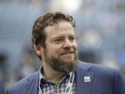 Seattle Seahawks general manager John Schneider walks on the field during warmups before an NFL football game against the Los Angeles Rams, Thursday, Oct. 3, 2019, in Seattle. The Seahawks have agreed to a contract extension with general manager John Schneider that will keep him tied to the franchise through the 2027 draft. The Seahawks announced Schneider&#039;s extension on Tuesday, Jan. 12, 2021, three days after their season ended in a 30-20 loss to the Los Angeles Rams in the NFC wild-card playoff game.