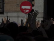 Protesters demonstrate June 22, 2018, while blocking the street outside the Justice Ministry in Madrid, Spain. The first comprehensive internal inquiry on sex abuse allegations by a religious order in Spain has identified 81 children and 37 adult victims by 96 Jesuits since the late 1920s, in a report released Friday.