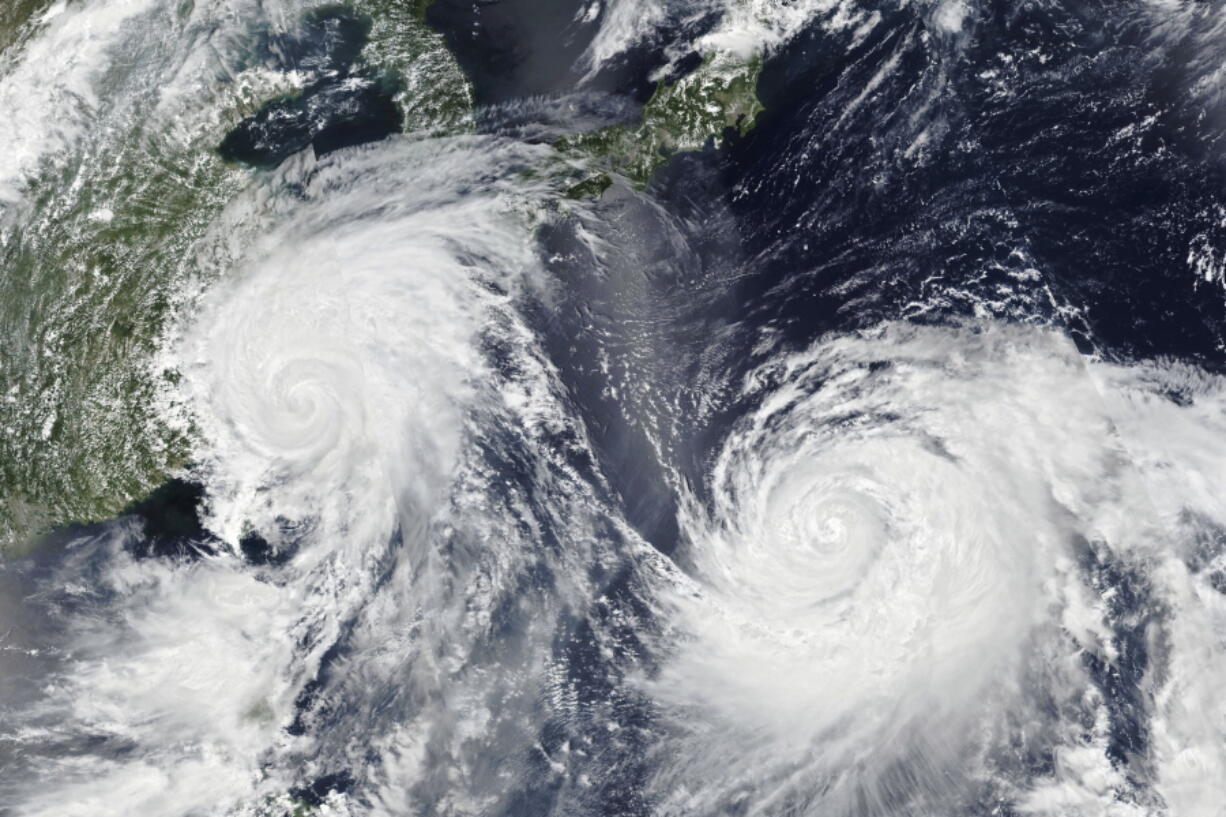 Typhoon Lekima, left, skirts north of Taiwan and towards eastern China. Typhoon Krosa is at right.