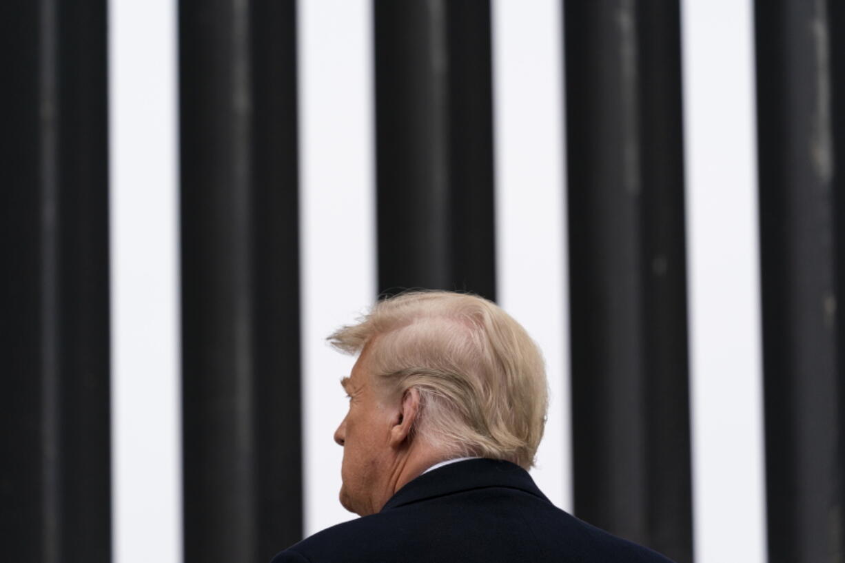 President Donald Trump tours a section of the U.S.-Mexico border wall, Tuesday, Jan. 12, 2021, in Alamo, Texas.