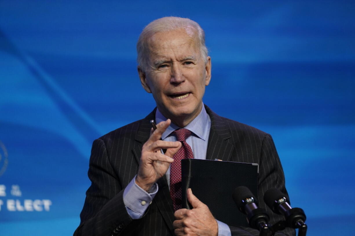 FILE - In this Jan. 8, 2021, file photo, President-elect Joe Biden speaks during an event at The Queen theater in Wilmington, Del. A coronavirus action plan fromBiden centers on a mass vaccination campaign and closer coordination among all levels of government. The Biden plan comes as a divided nation remains caught in the grip of the pandemic&#039;s most dangerous wave yet.