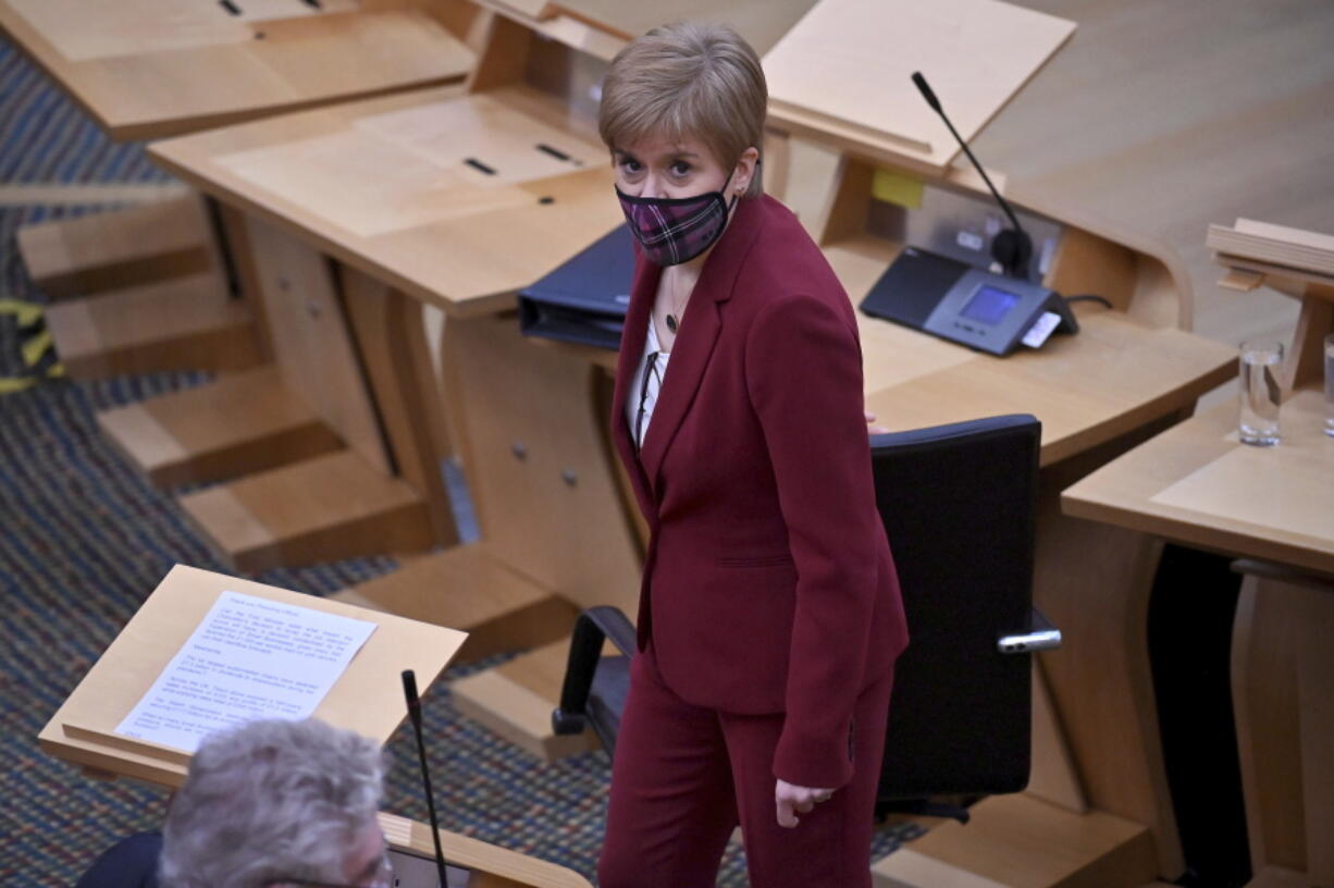 Scotland&#039;s First Minister Nicola Sturgeon looks on during First Minister&#039;s Questions at the Scottish Parliament in Edinburgh, Thursday, Nov. 19, 2020.