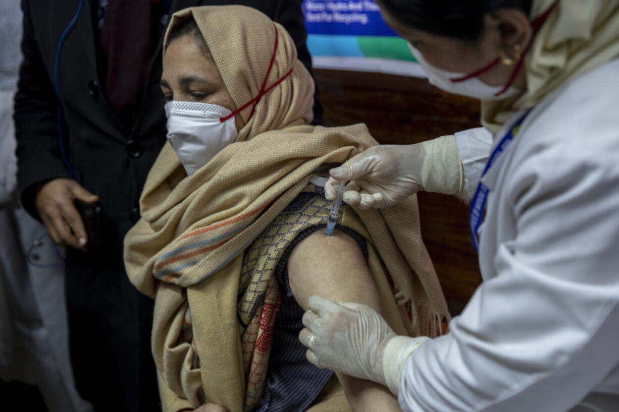 A hospital staff receives a COVID-19 vaccine at a government Hospital in Srinagar, Indian controlled Kashmir, Saturday, Jan. 16, 2021. India started inoculating health workers Saturday in what is likely the world&#039;s largest COVID-19 vaccination campaign, joining the ranks of wealthier nations where the effort is already well underway.