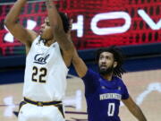 California forward Andre Kelly (22) takes a shot in front of Washington guard Marcus Tsohonis (0) during the first half of an NCAA college basketball game, Saturday, Jan. 9, 2021, in Berkeley, Calif.