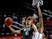 Washington State guard Isaac Bonton (10) goes up to basket under pressure from Southern California forward Evan Mobley (4) during the second half of an NCAA college basketball game Saturday, Jan. 16, 2021, in Los Angeles. (AP Photo/Ringo H.W.