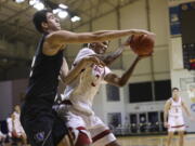 Washington center Riley Sorn (52), left, defends a shot against Stanford forward Ziaire Williams (3) during the first half of an NCAA college basketball game in Santa Cruz, Calif., Thursday, Jan. 7, 2021.