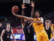 Southern California forward Isaiah Mobley, right, scores over Washington forward Nate Roberts (1) during the second half of an NCAA college basketball game Thursday, Jan. 14, 2021, in Los Angeles.