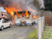 Two people were injured in a mobile home fire Saturday afternoon after a propane tank exploded inside the residence in Vancouver&#039;s Rose Village neighborhood.