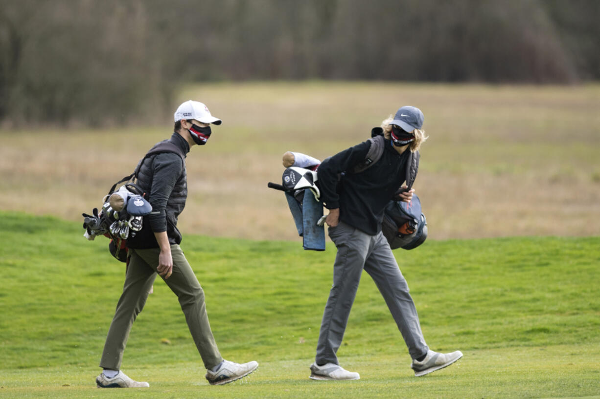 Senior Owen Huntington, left, and sophomore Eli Huntington are enjoying one last run as teammates on a talented Camas boys golf team.