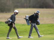 Senior Owen Huntington, left, and sophomore Eli Huntington are enjoying one last run as teammates on a talented Camas boys golf team.