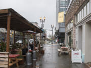 Customers take shelter in an outdoor dining area of Little Conejo in downtown Vancouver. Declining COVID-19 activity has allowed Clark County to move into Phase 2 of the state&#039;s reopening plan, which will allow indoor dining, with restrictions, to resume on Monday.