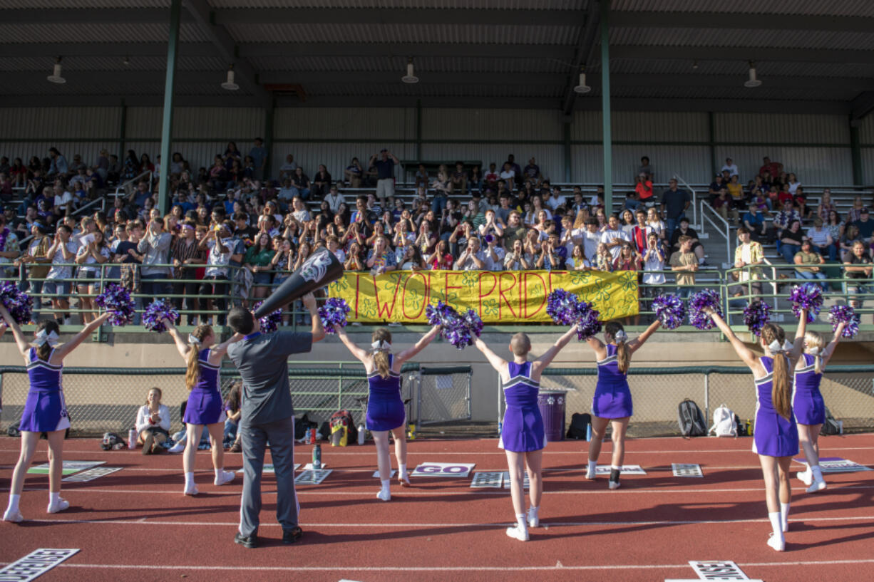 Heritage&#039;s student section and cheer team support their team during the 2019 season opener at McKenzie Stadium. Attendance at games in 2021 will be extremely limited due to health guidelines.