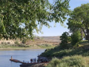 People gather on the boat dock at Unity Lake State Recreation Area in Eastern Oregon.