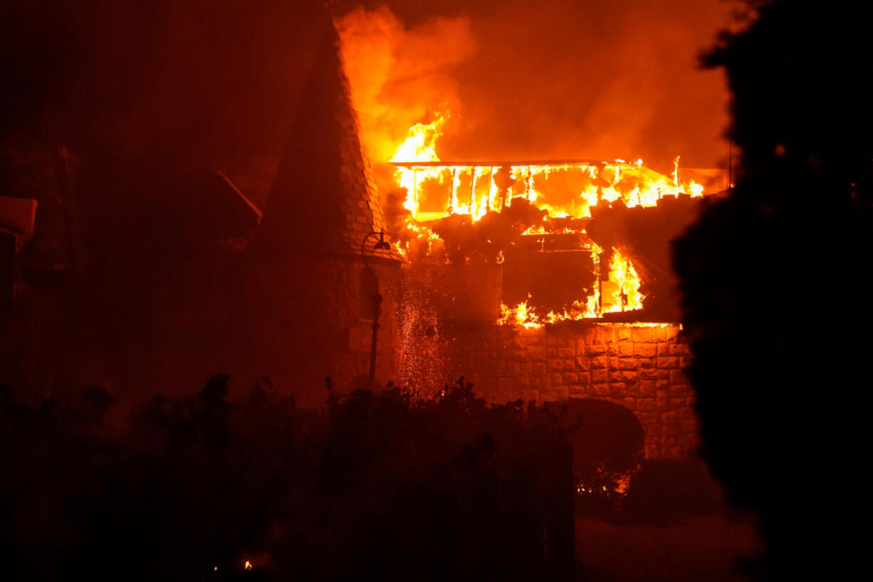 The Glass Fire burns along Silverado Trail in Napa County near the Chateau Boswell Winery on Sept. 27 in St. Helena, Calif.