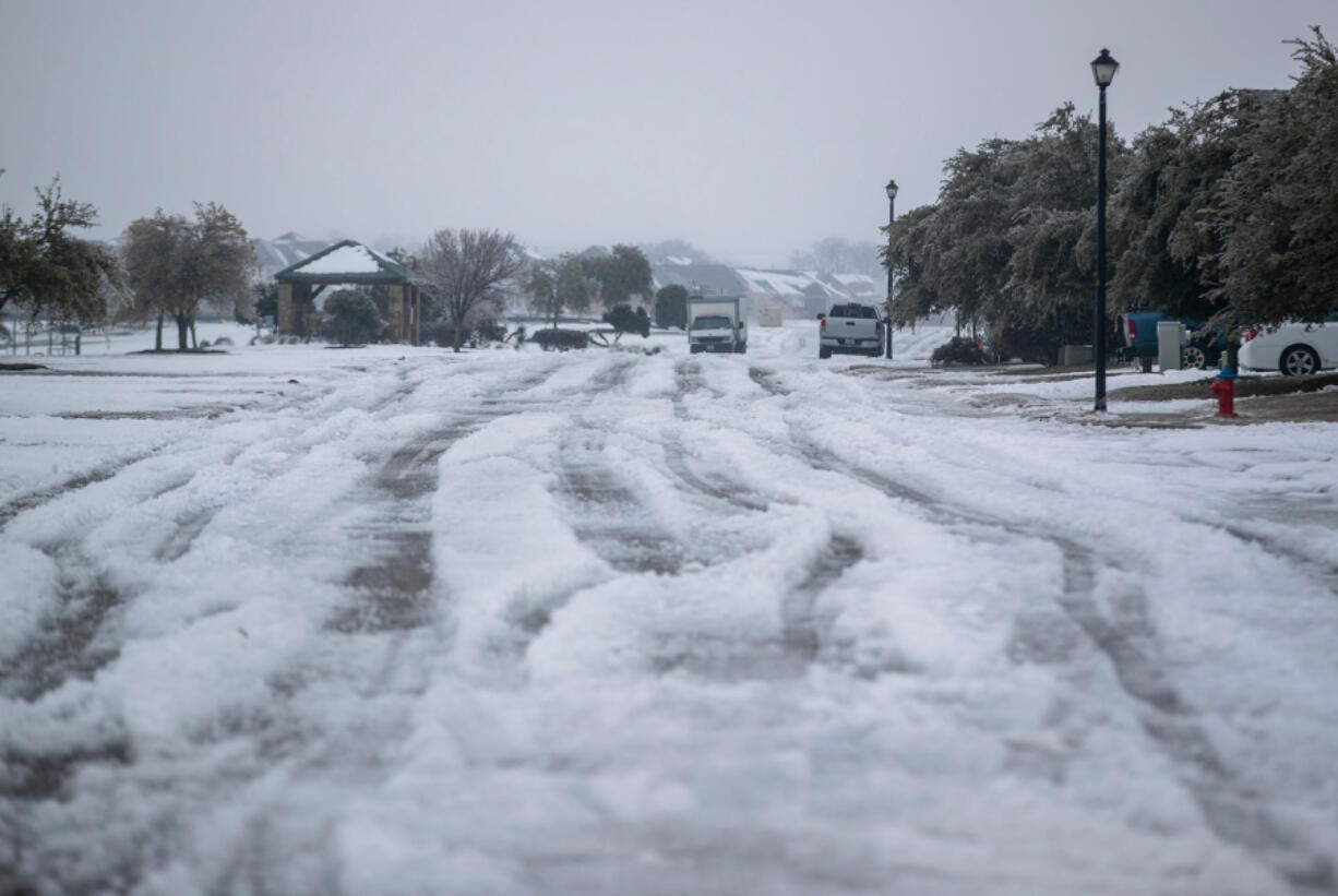 A winter storm that brought snow, ice, and plunging temperatures across Central Texas shut down roads and caused the electrical grid to shut down, leaving thousands of people without power. (Ricardo B.