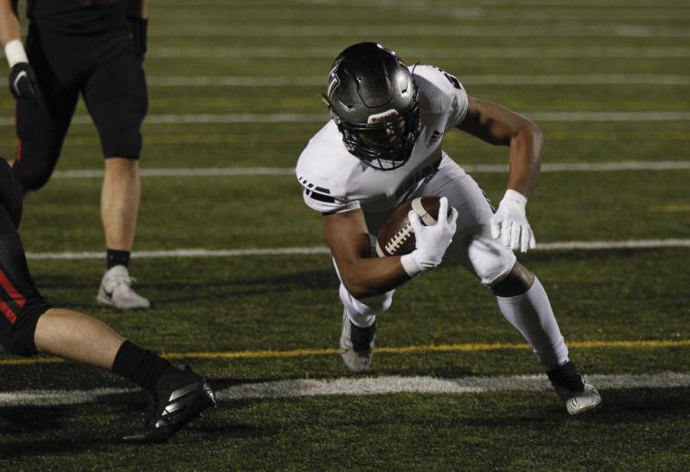 Union running back Jaydon Jones,crosses the goal line for a score against Camas.