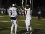 Union running back Jaydon Jones, right, celebrates a score against Camas with teammate Jake Bowen, left.