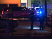 Law enforcement officials from multiple agencies converge at the parking lot of a Hazel Dell US Bank branch on Oct.