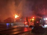 Vancouver firefighters on the scene of a house fire Thursday night on Southeast McGillivray Boulevard.