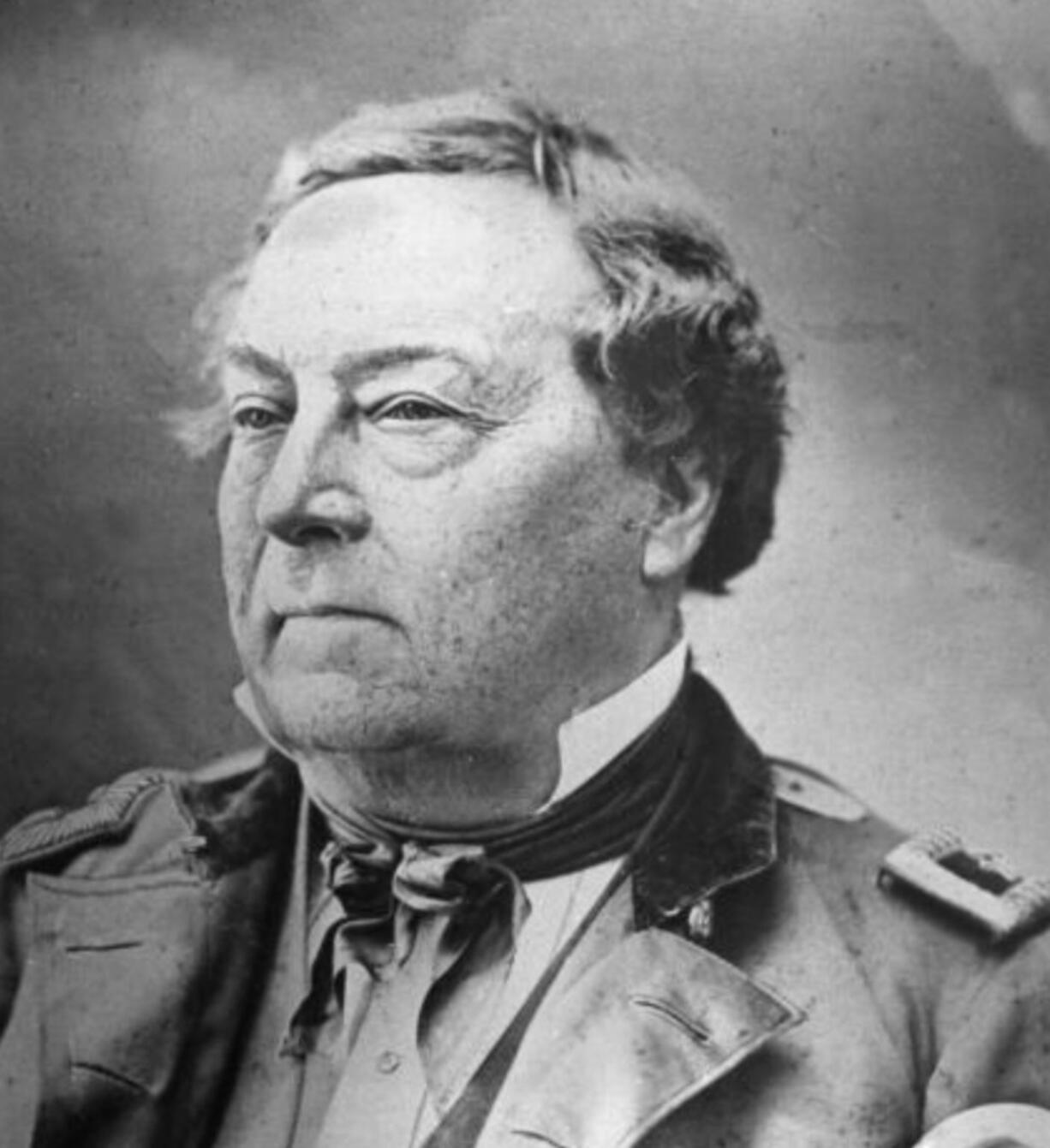 An officer of the U.S. Army, fur trapper and explorer, French-born Benjamin Louis Eulalie de Bonneville blazed portions of the Oregon Trail and explored the American West. In 1837, Washington Irving published a biography based on interviews of Bonneville, who relayed the explorations. Bonneville served as commander at the Fort Vancouver Barracks for two years. For this undated photo, he donned a hairpiece.