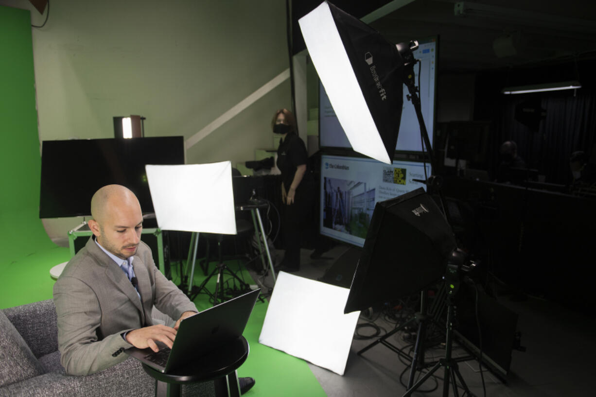 Will Campbell, assistant metro editor at The Columbian, makes preparations before hosting the annual Economic Forecast virtually at Wager Audio on Tuesday morning. The event, like all other events, has had to adapt to an all-virtual setting.