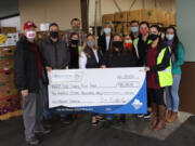 MINNEHAHA: Walk &amp; Knock officials Tom Knappenberger and Adam Hegewald, left, present a check for $115,000 to the Clark County Food Bank.