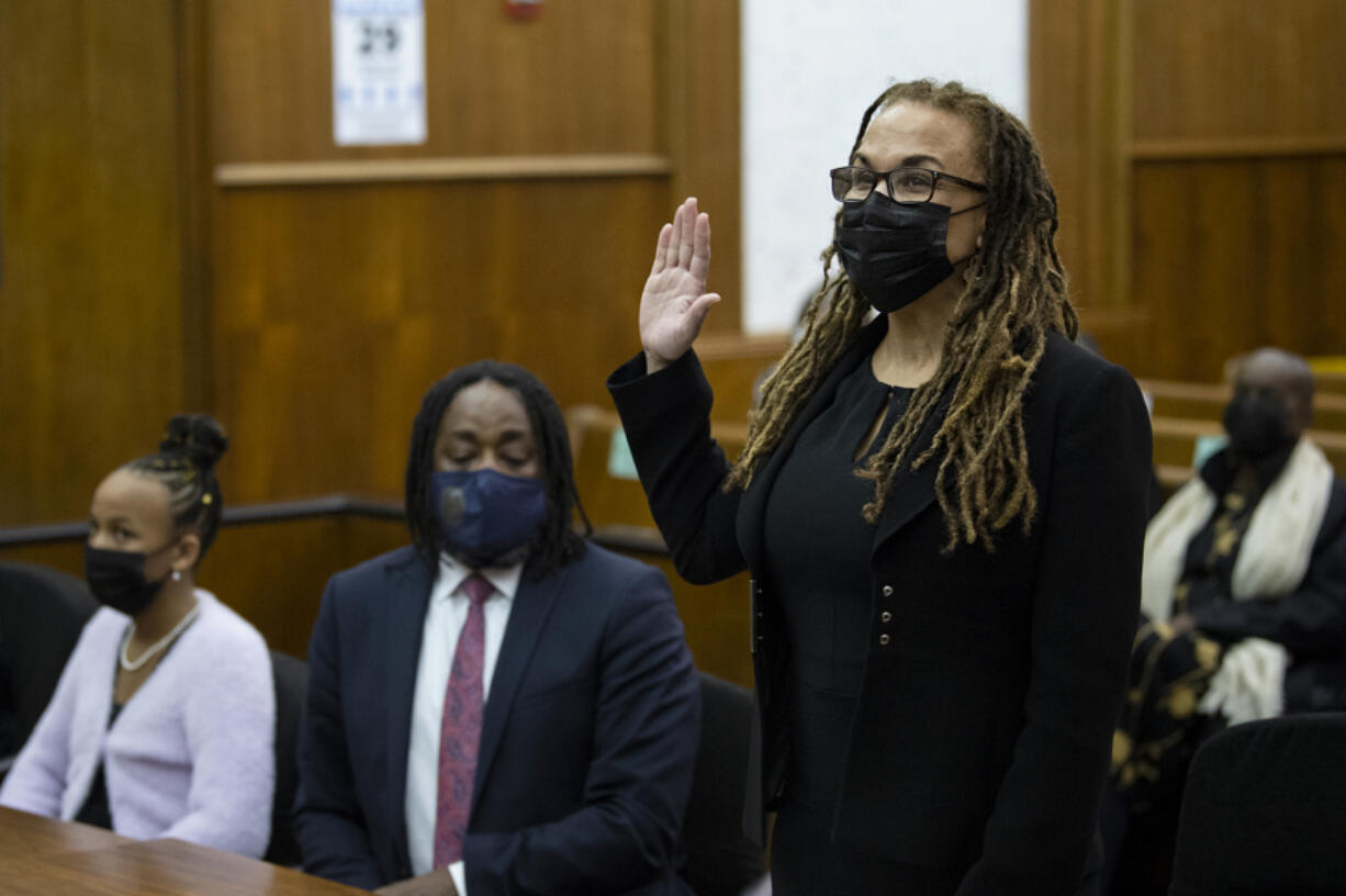 Camara Banfield takes the oath of office for Clark County Superior Court Judge during her investiture ceremony on Friday at the Clark County Courthouse in Vancouver. Banfield is the first woman of color to work as a Superior Court Judge locally.