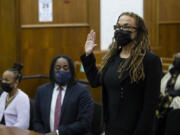 Camara Banfield takes the oath of office for Clark County Superior Court Judge during her investiture ceremony on Friday at the Clark County Courthouse in Vancouver. Banfield is the first woman of color to work as a Superior Court Judge locally.