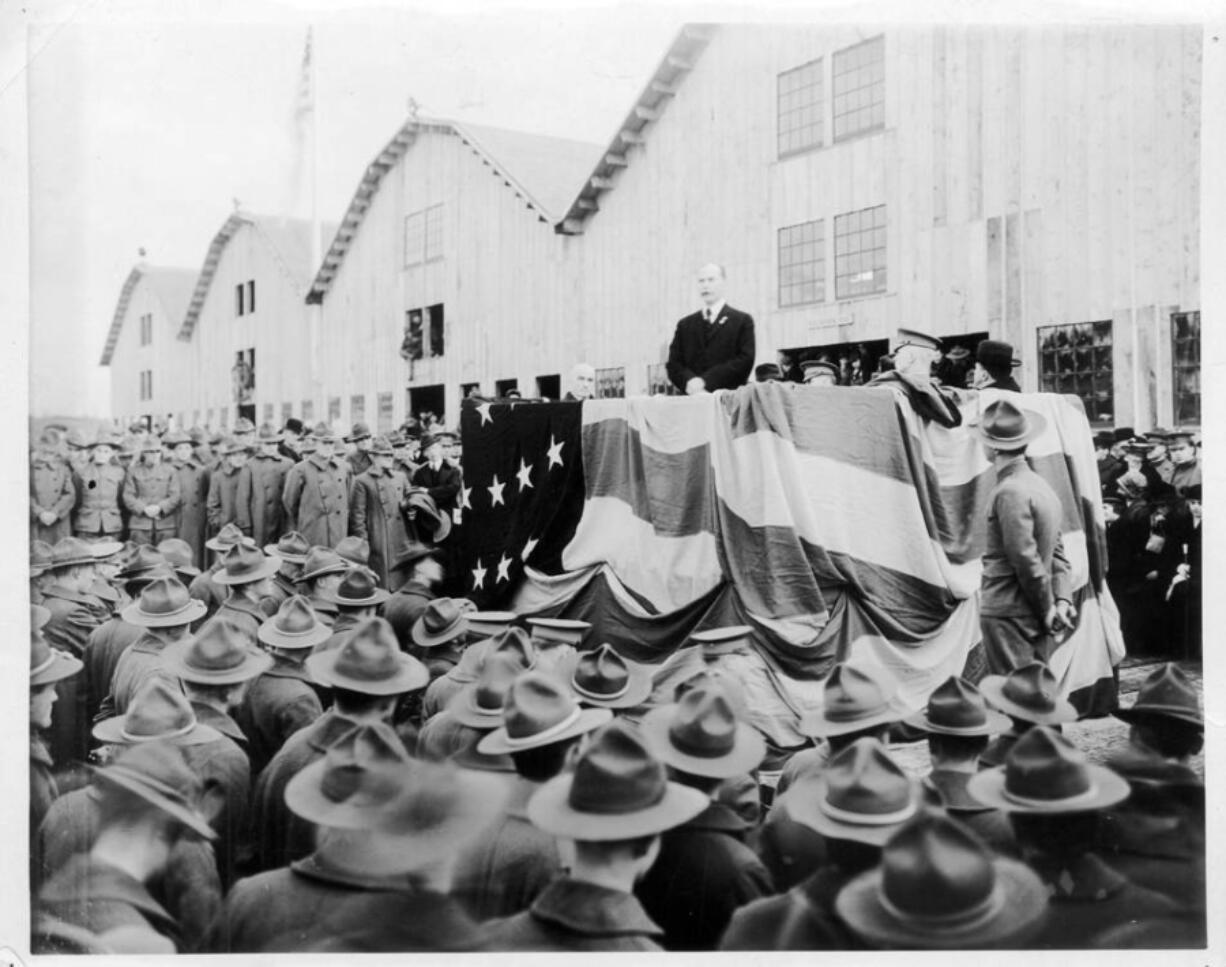 Mayor Percival addresses 8,000 soldiers in front of the recently completed Spruce Production Mill in February 1918. The mill processed the lightweight, flexible wood needed for planes. Of the crowd attending, 2,400 soldiers worked at the mill. The rest came from around the Pacific Northwest. The Spruce Production Division commanded 25,000 soldiers. Three years after his speech before this crowd, well-liked Mayor Percival disappeared, throwing all of Clark County into a tizzy.