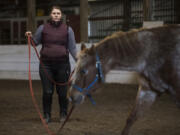 Kassandra Bullcreek, ranch manager at Silver Buckle Ranch in Brush Prairie, leads Angel, 14, a Pony of the Americas, through lunging exercises. The ranch has experienced growth during the pandemic. &quot;What I&#039;ve found we are one of the few places where people can get out and do something while remaining safe and socially distanced because we are an open-air environment,&quot; Bullcreek said. &quot;Even our covered arena is open on the sides. I think with the stresses of the pandemic a lot of people are looking for an outlet. It tends to be a release and a happy place to be around horses outside. It was a very sudden jump.