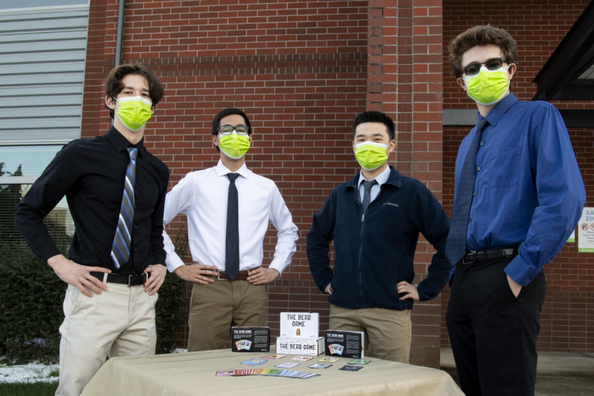 From left, Joshua Helm, Steven Nguyen, Austin Lee and Colton Harris with The Bear Game at Union High School. The four seniors are the creative and marketing force behind The Bear Game family card game.