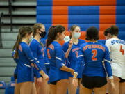 Ridgefield’s Presley McCaskill adjusts her mask during a timeout on Tuesday, February 16, 2021, at Ridgefield High School. Ridgefield won 25-20, 25-9, 25-12 over Mark Morris in its first volleyball match since winning the 2A State Championship in fall 2019.