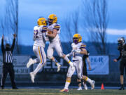 Columbia River celebrates in the end zone before a penalty took back the touchdown during a season opener game at Woodland High School on Saturday night, Feb. 20, 2021.