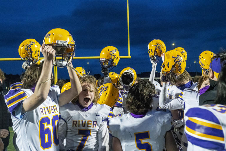 Columbia River celebrates their season opener win against Woodland at Woodland High School on Saturday night, Feb. 20, 2021.