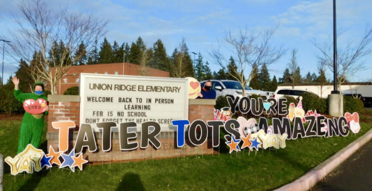 RIDGEFIELD: The entry to the parking lot at Union Ridge Elementary School had a huge sign and teachers in costumes to greet the students for a Valentine&#039;s Day drive-thru event.