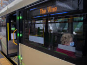 Heather Manning of Vancouver sits aboard a C-Tran Vine bus headed east while departing from the Turtle Place Transit Station in downtown Vancouver on Monday. The Vine runs along Fourth Plain Boulevard and is Vancouver&#039;s first Bus Rapid Transit line, though two more are in the works.