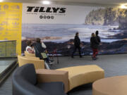 Shoppers rest on recently upgraded seating while others walk by in front the future Tillys storefront at the Vancouver Mall. The casual apparel retailer is set to open in the second quarter of this year, and another big-name clothing chain, Windsor, will debut in the third quarter.