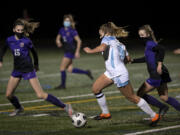 Hockinson junior Payton Lawson weaves her way through the Columbia River defense on Saturday, February 27, 2021, at Columbia River High School. The Hawks earned a 1-0 victory over Columbia River in a rematch of the 2019 2A State girls soccer championship.