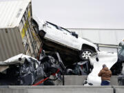 Vehicles are piled up after a fatal crash on Interstate 35 near Fort Worth, Texas on Thursday, Feb. 11, 2021.  The massive crash involving 75 to 100 vehicles on an icy Texas interstate killed some and injured others, police said, as a winter storm dropped freezing rain, sleet and snow on parts of the U.S.